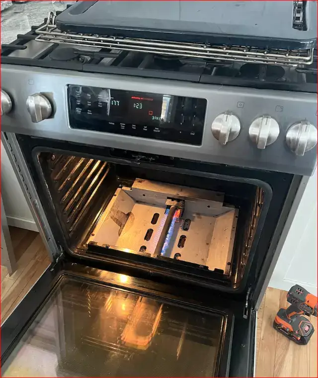 oven-repair-oven-being-fixed-elements-bottom-oven-exposed-tools-on-the-floor